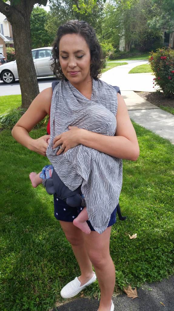 Shift the baby and the carrier pouch to the side on which you intend to nurse.